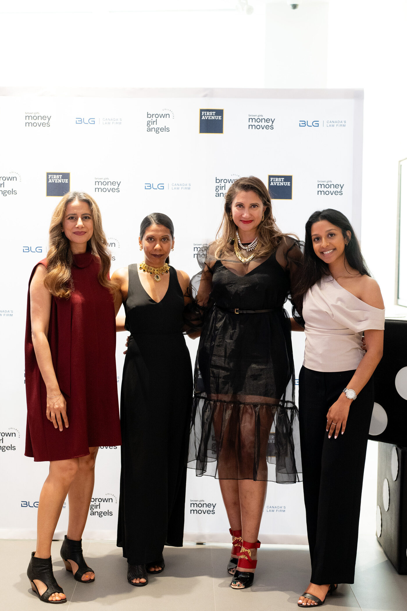 A wide shot of a Brown Girls learning session with a speaker on stage