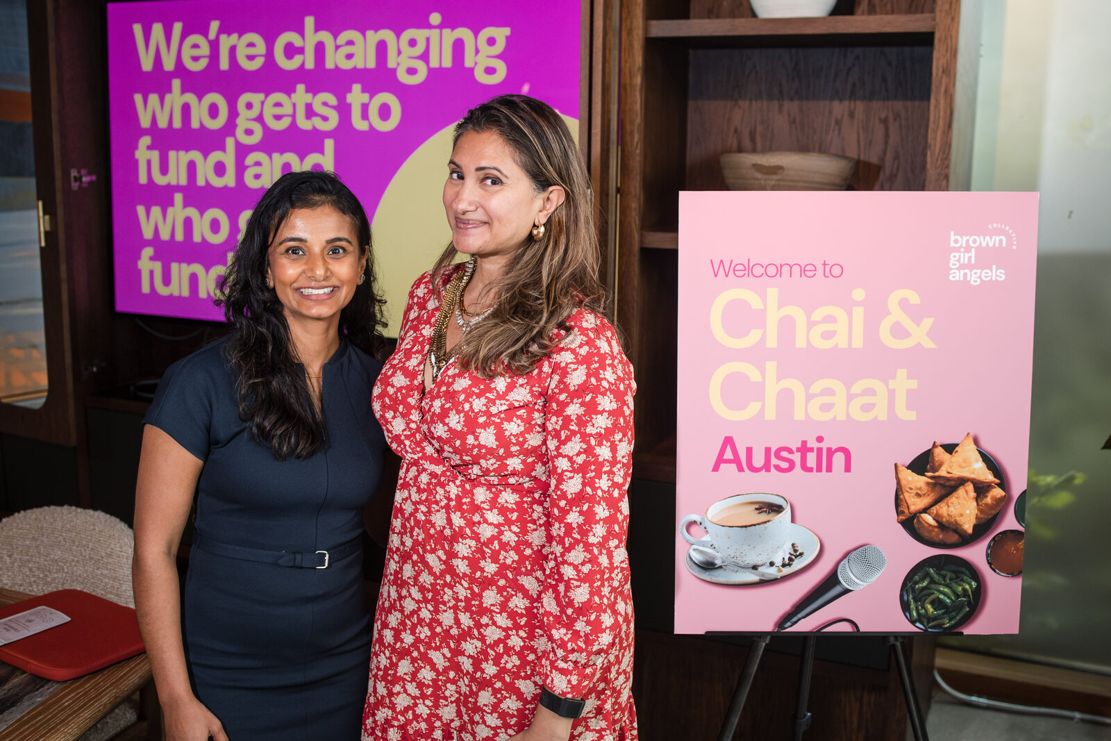 Bhargavi Varma with a Chai & Chaat Austin guest in front of the &lsquo;changing who gets to fund&rsquo; screen