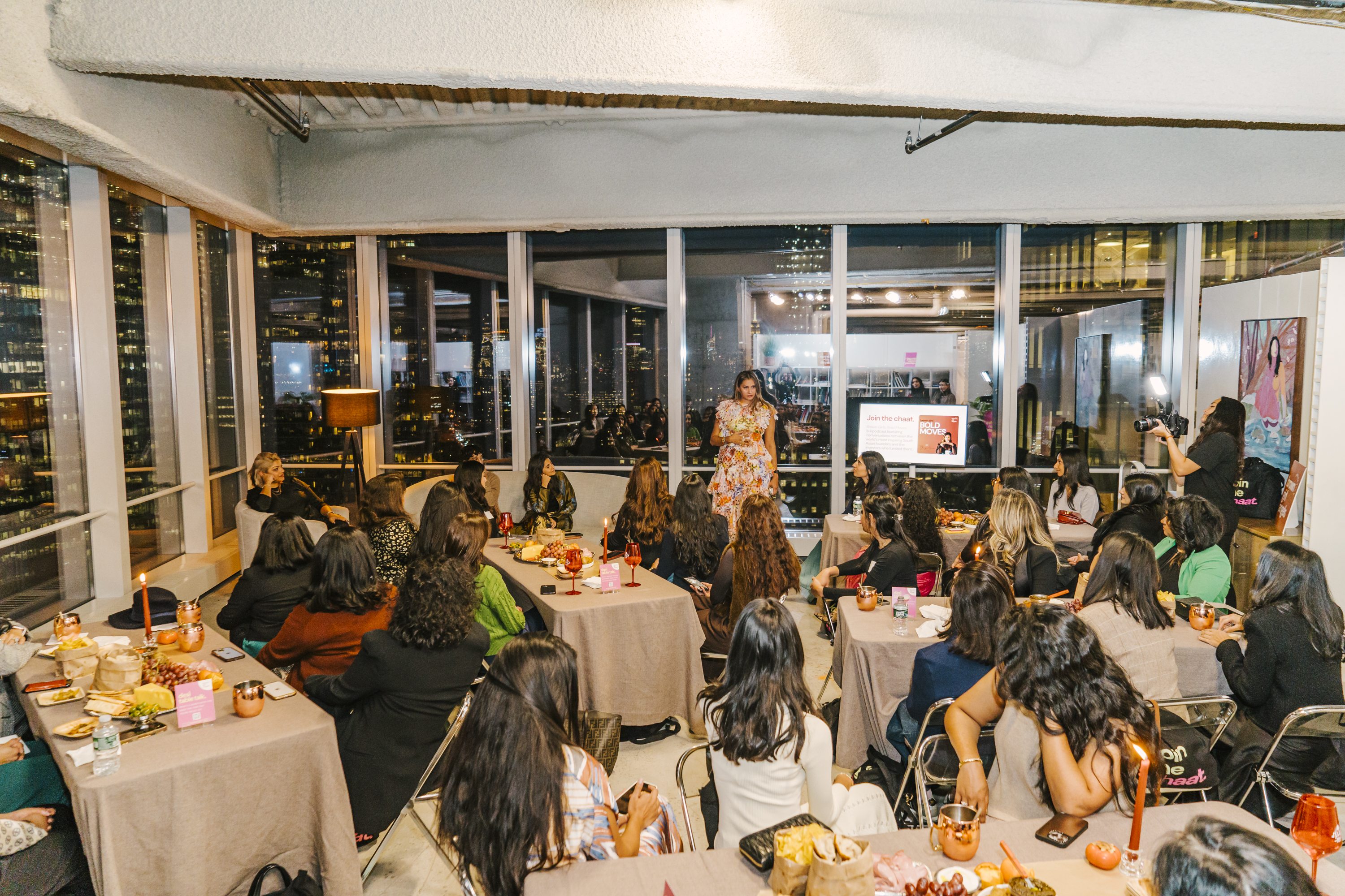 A room of senior South Asian women applauding at the Brown Girl Angels SickKids cultural fundraiser in New York.
